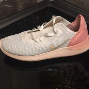 White and peach Nike running shoe